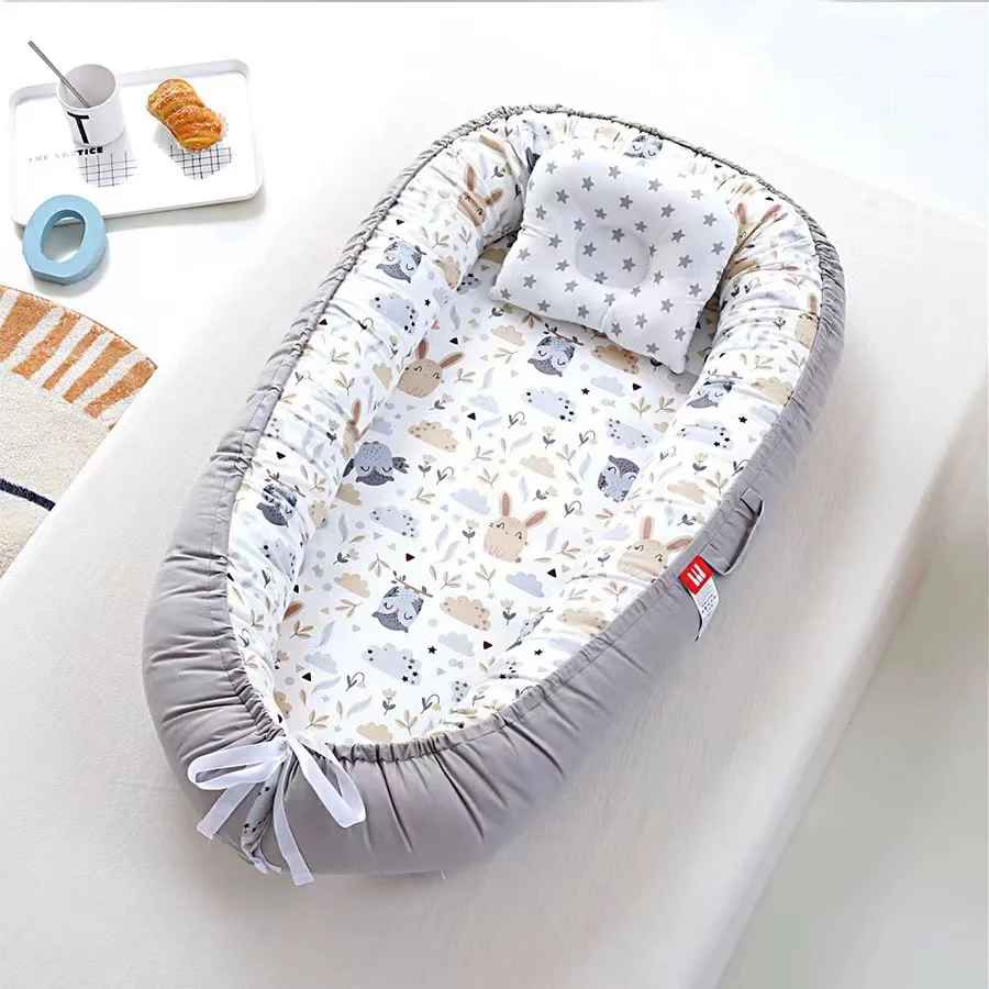 réducteur de lit bébé