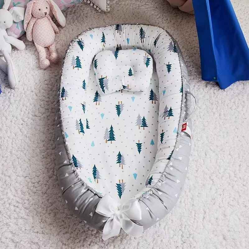 réducteur de lit bébé