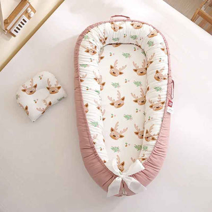 reducteur de lit bebe rose biche